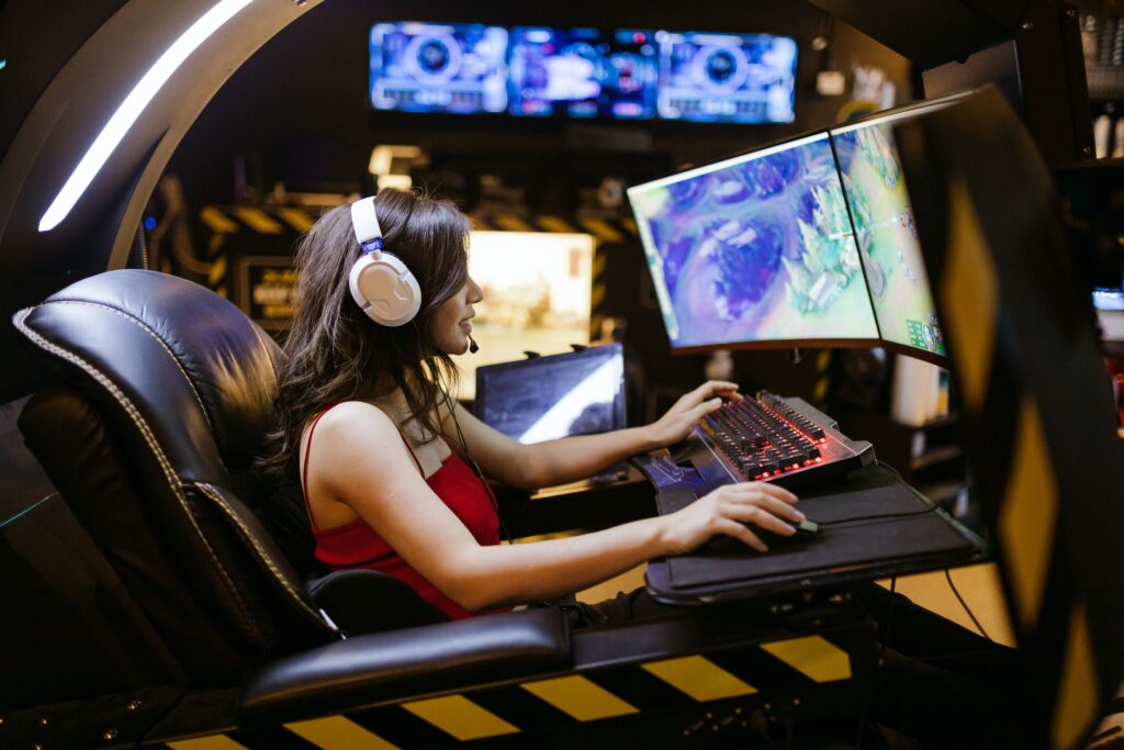 young woman with headphones playing eSports